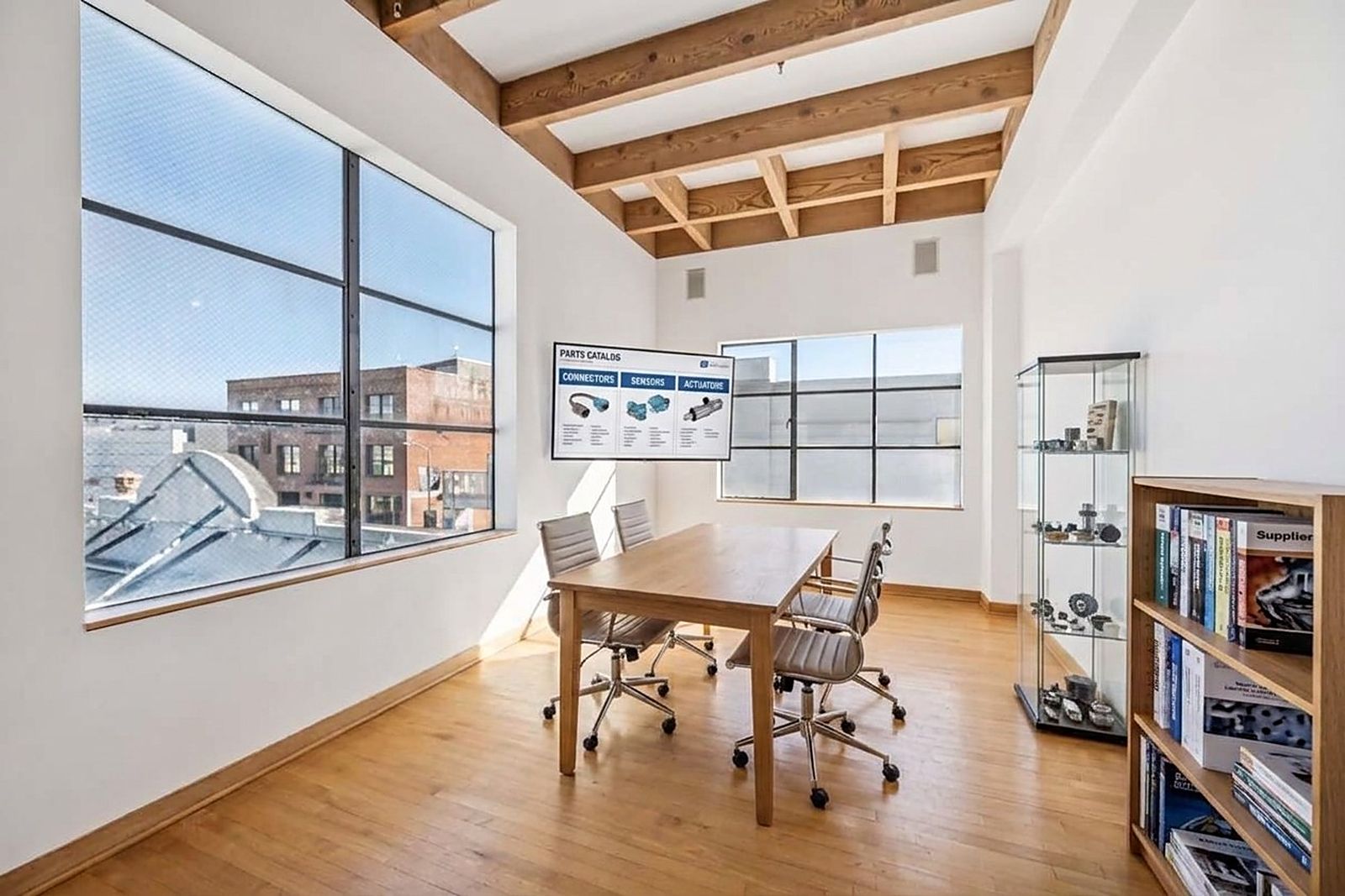 A meeting pod with a product case and a window