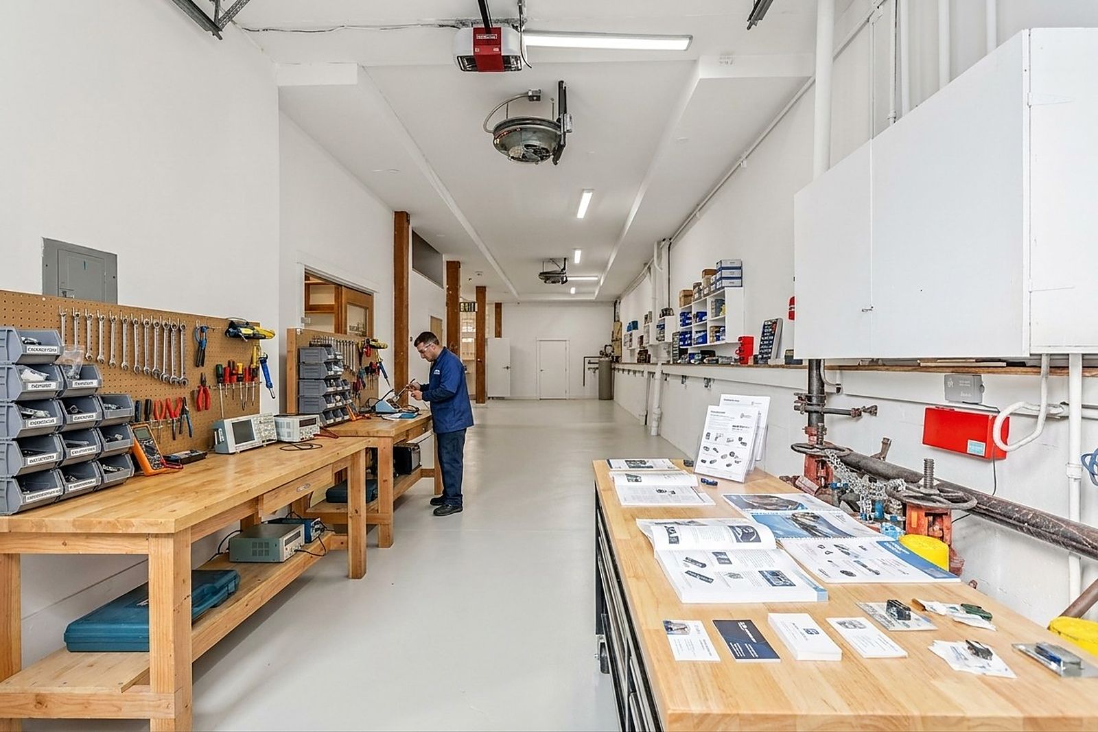 Workshop benches with tools and sample teardowns
